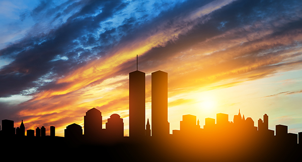 NY skyline from the water with twin towers of light at Ground Zero after violent Muslim terrorist attacks on September 11th.